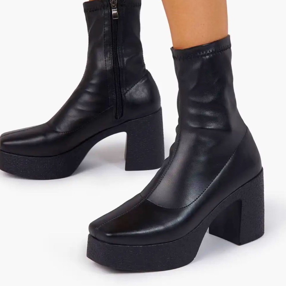 Black Faux leather fitted ankle boots with side zip, platform heel. Brand New.